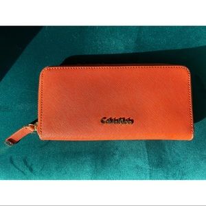 Calvin-Klein Orange Leather Zip Continental Wallet